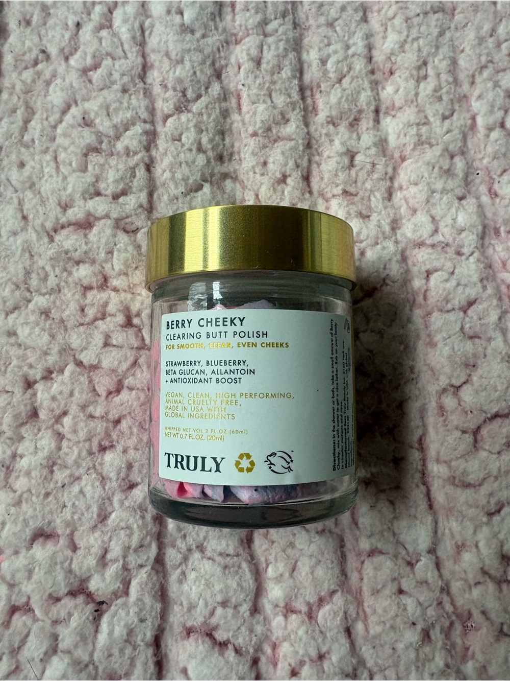 TRULY Gold Lid Jar on Pink Surface